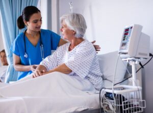 female doctor examining senior female patient